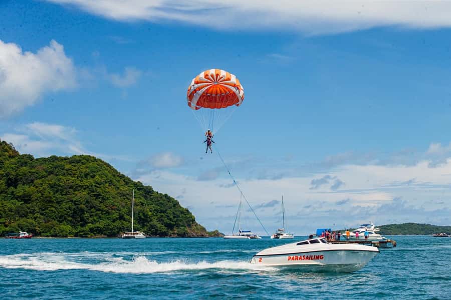 From Phuket: Coral Island Kahung Beach Speedboat Trip - Kahung Beach arrival: chairs, shade strategy, and first swim
