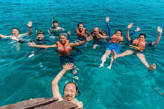 Koh Rok and Koh Ha Private Boat Tour - Koh Rang Yai relaxation: fresh fruit, light refreshments, and downtime