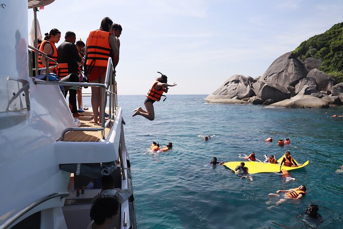 Phi Phi Island & Maiton Island Full Day Tour with Luxury Yacht - Maiton Private Island: water slides, paddle boards, a glass-bottom boat, and a second snorkel