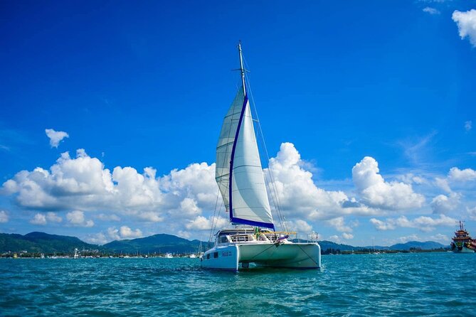 Phuket Catamaran Snorkel & Sunset: Coral & Racha - Promthep Cape Sunset Stop and Included Line Fishing