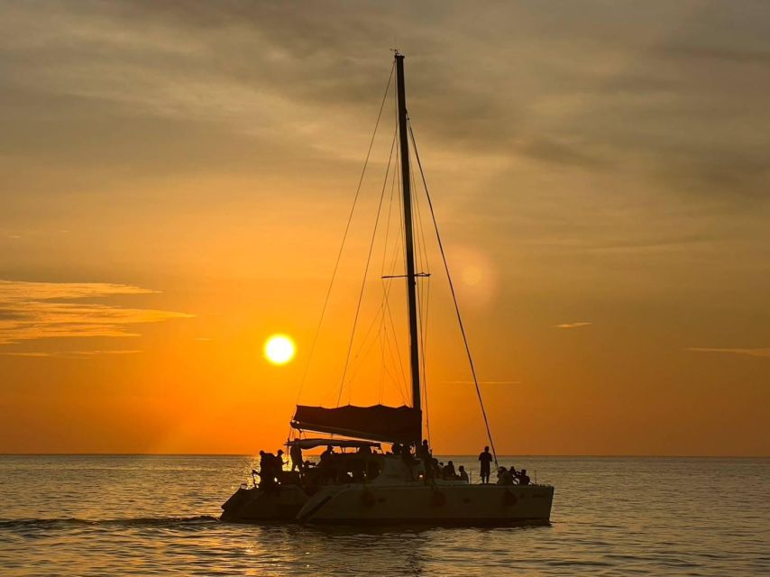 Phuket: Coral Island & Sunset Dinner by Sailing Catamaran - Koh Hey (Coral Island): beach time, swimming, and snorkeling reality checks