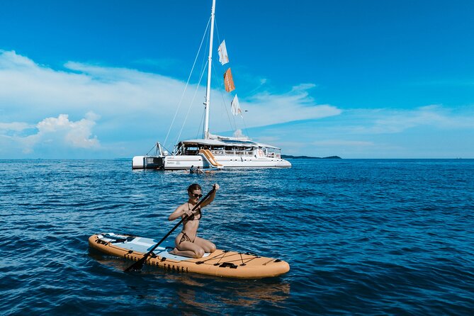 Rhapsody Phuket Coral & Racha Sunset Catamaran Cruise - Coral Island and Banana Beach time, plus optional thrill rides